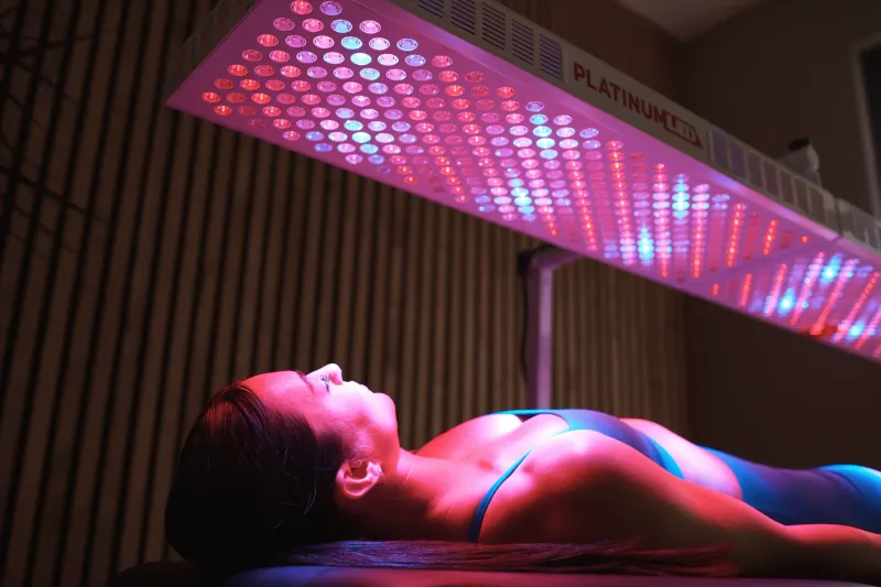Red light therapy room with full-body LED panel at The Salt Room Oviedo