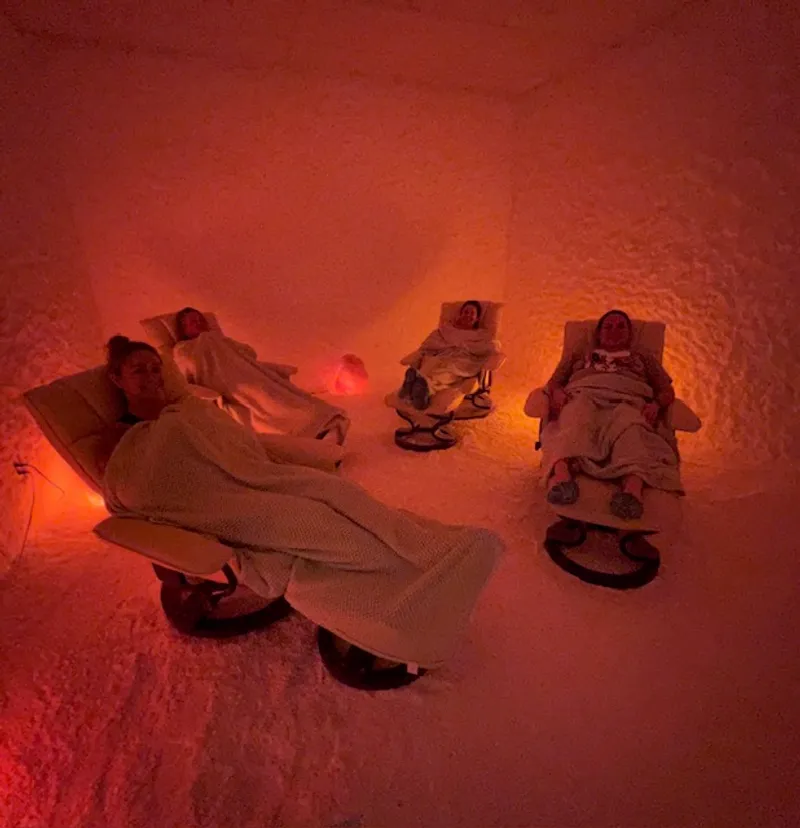 Adult salt cave interior with Himalayan salt lamps